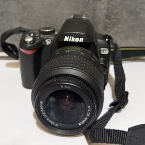 Nikon DSLR Camera in Black and Red